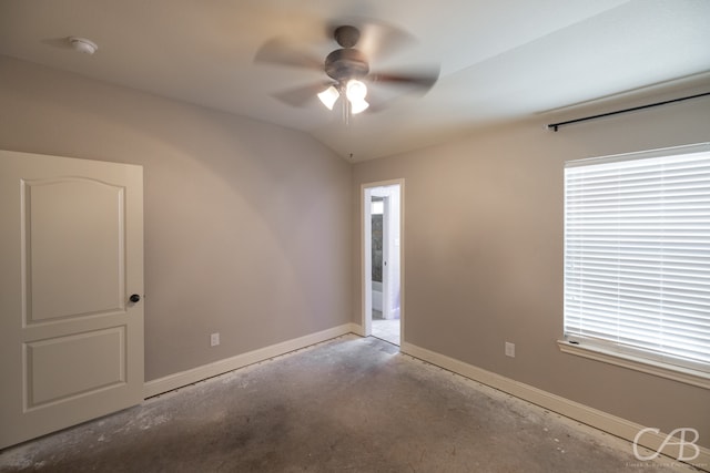 spare room with vaulted ceiling and ceiling fan