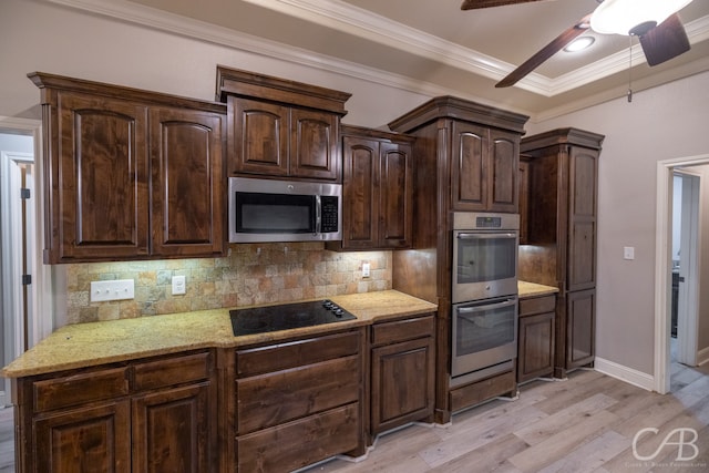 kitchen featuring ceiling fan, dark brown cabinetry, ornamental molding, light hardwood / wood-style flooring, and appliances with stainless steel finishes