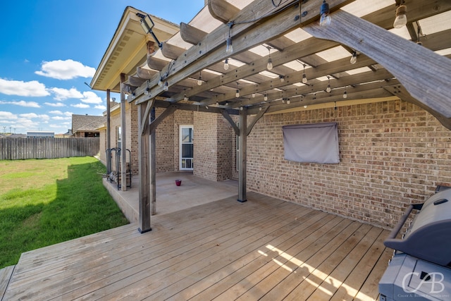 wooden terrace featuring a pergola and a lawn