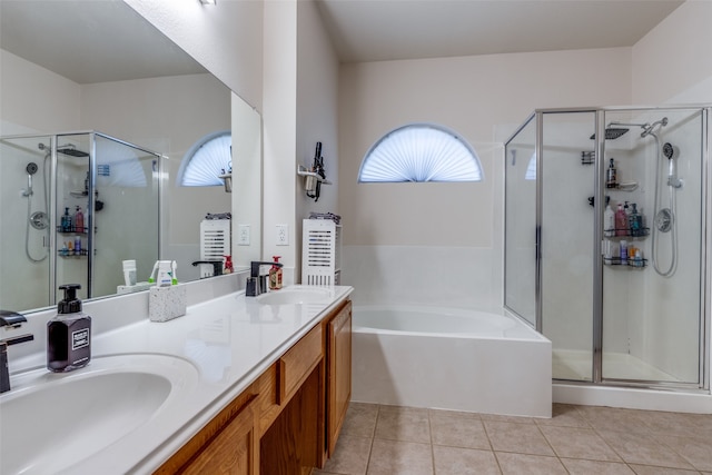 bathroom featuring tile patterned floors, independent shower and bath, and vanity