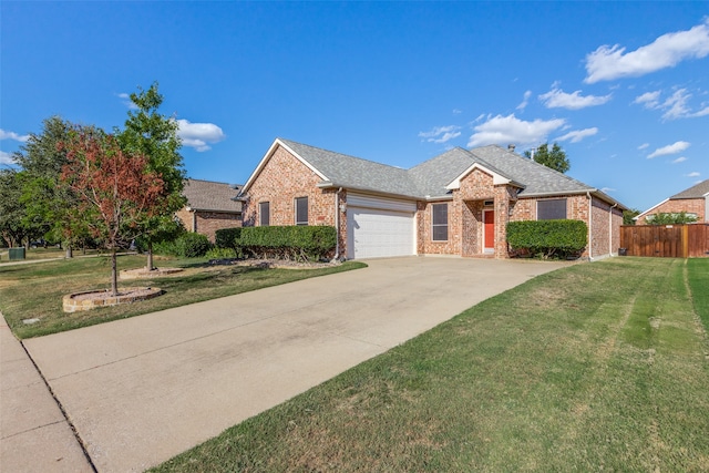 view of front of home featuring a garage and a front lawn