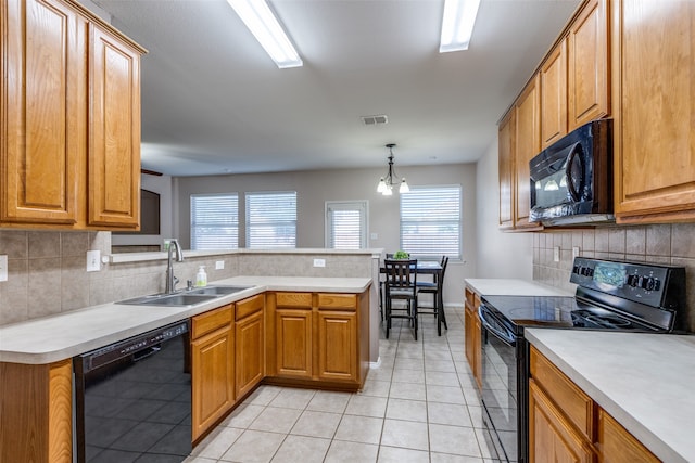 kitchen featuring a chandelier, sink, kitchen peninsula, black appliances, and decorative light fixtures