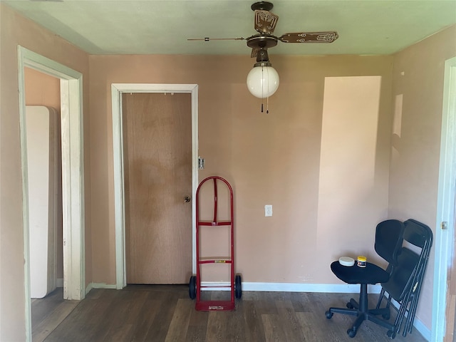 home office featuring ceiling fan and dark hardwood / wood-style flooring