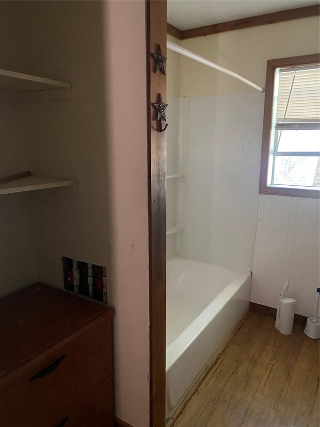 bathroom with bathtub / shower combination and wood-type flooring