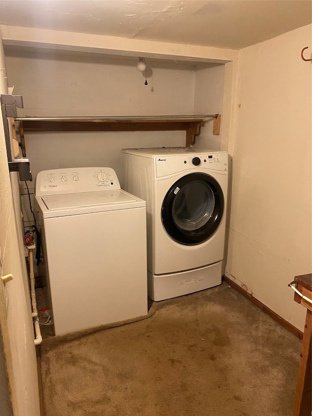 washroom featuring dark carpet and washer and dryer