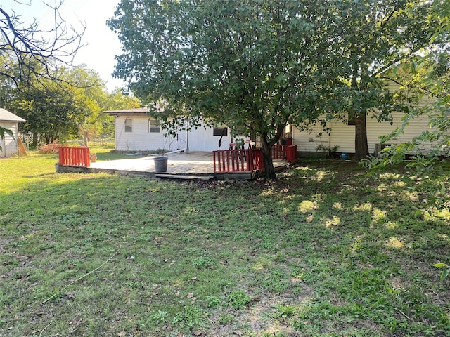 view of yard with a deck