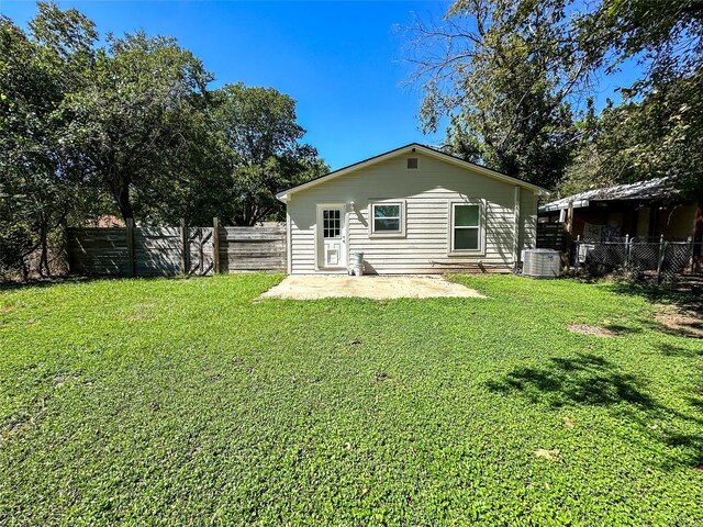 view of yard featuring central AC and a patio area