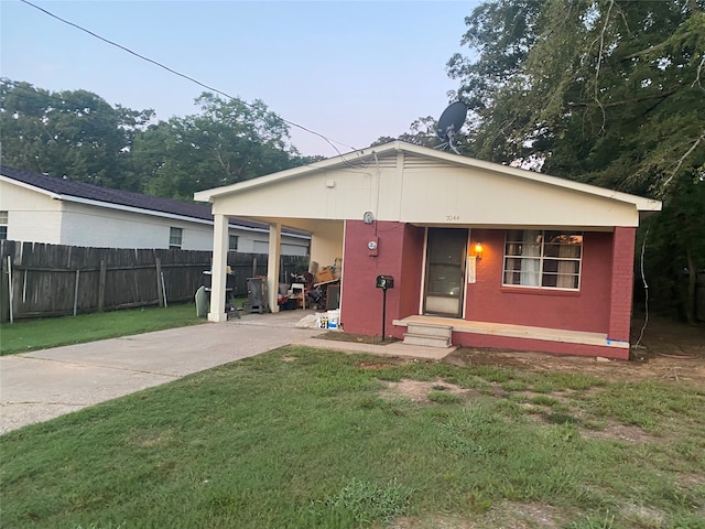 rear view of property with a yard