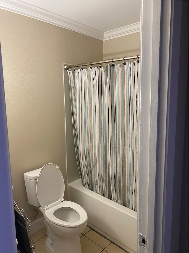 bathroom featuring crown molding, shower / tub combo with curtain, toilet, and tile patterned floors