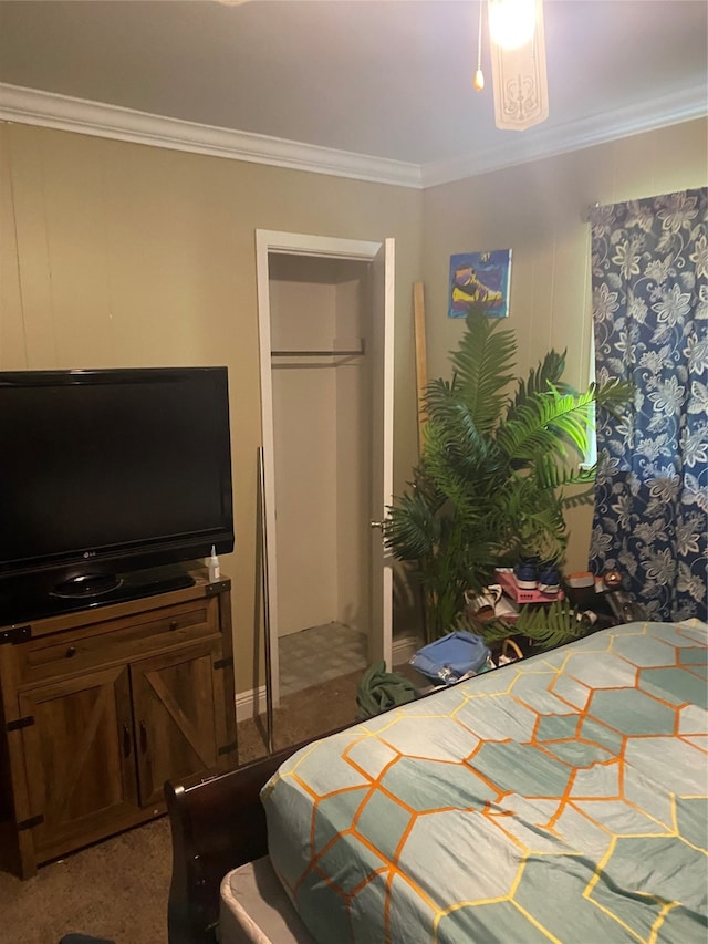 carpeted bedroom with a closet and ornamental molding