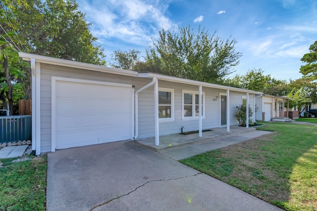 ranch-style home with a front yard and a garage