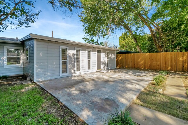 rear view of house with a patio