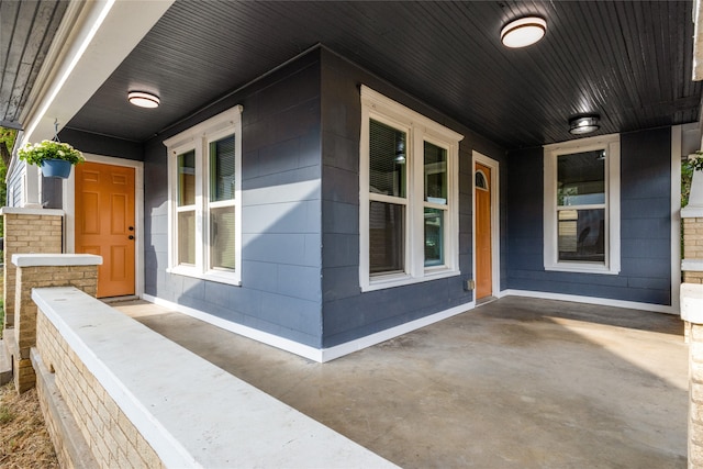 view of property exterior featuring covered porch