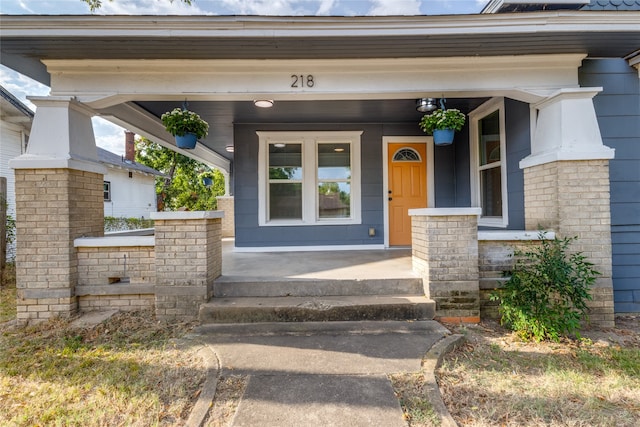 property entrance with covered porch