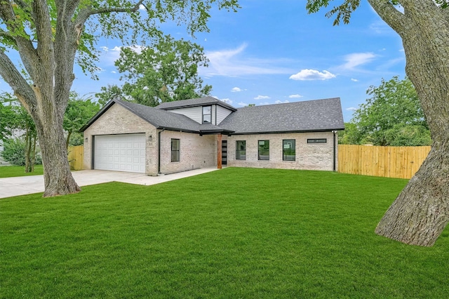 view of front facade with a garage and a front yard