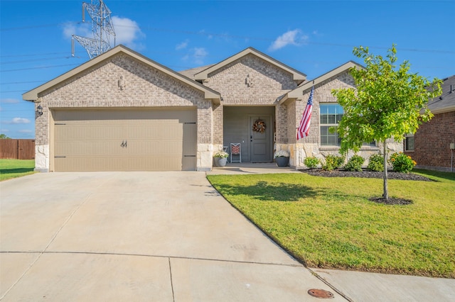 view of front facade featuring a front yard and a garage