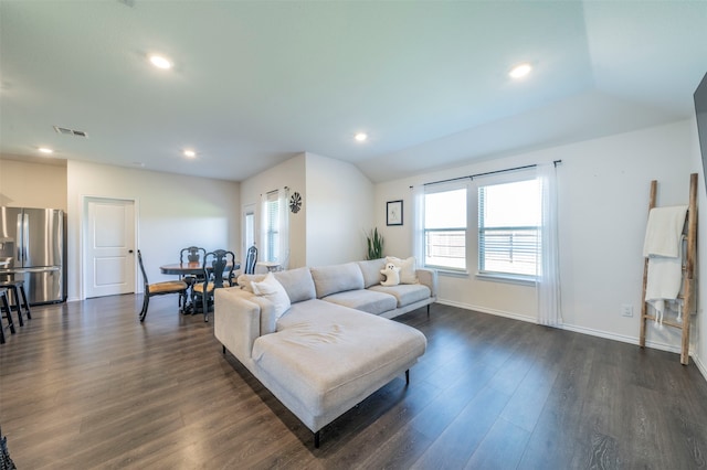 living room with vaulted ceiling and dark wood-type flooring