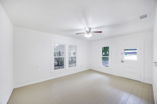 empty room featuring ceiling fan and hardwood / wood-style flooring