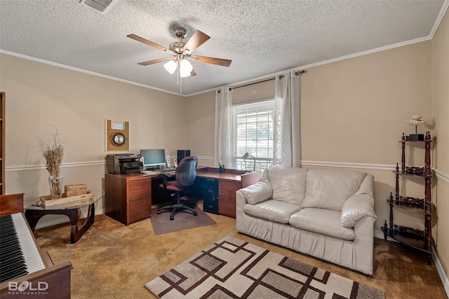 carpeted home office with ceiling fan, a textured ceiling, and ornamental molding