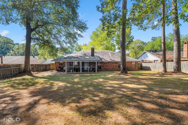 view of yard featuring a sunroom