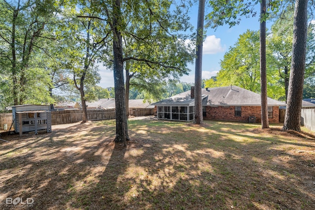 view of yard with a sunroom