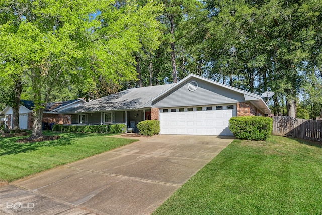 ranch-style home with a garage and a front lawn