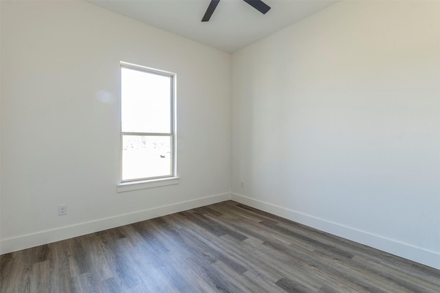 unfurnished room featuring ceiling fan and dark hardwood / wood-style flooring