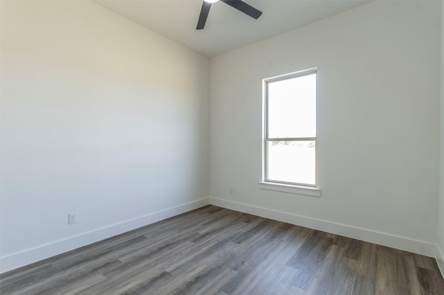 spare room with hardwood / wood-style flooring and ceiling fan