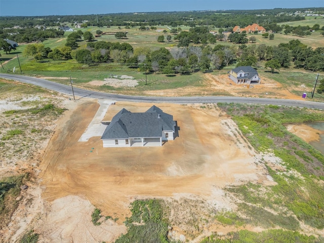 birds eye view of property with a rural view