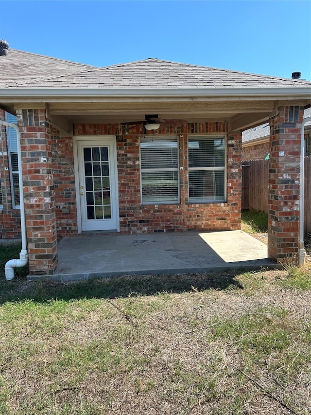 back of property featuring a yard and a patio area