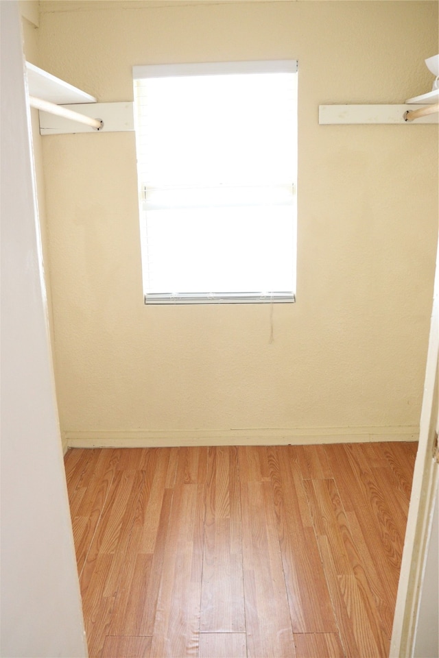 spacious closet with light wood-type flooring