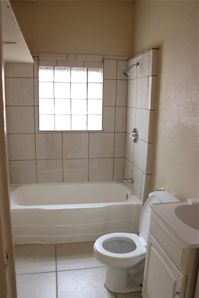 full bathroom with tiled shower / bath combo, vanity, and toilet