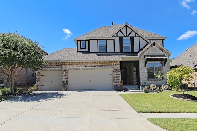 view of front of property with a garage and a front yard