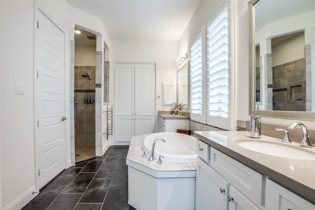 bathroom featuring vanity, separate shower and tub, and tile patterned floors