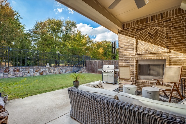 view of patio / terrace with an outdoor kitchen, outdoor lounge area, and grilling area