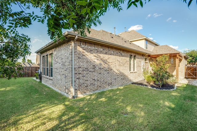 view of property exterior featuring a lawn