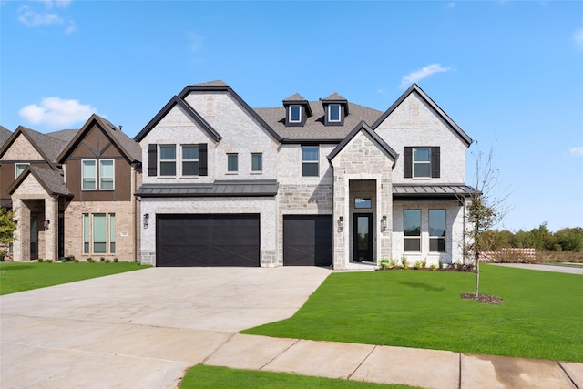 view of front of home with a garage and a front yard