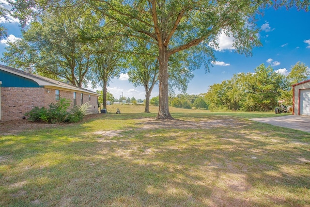 view of yard with a garage