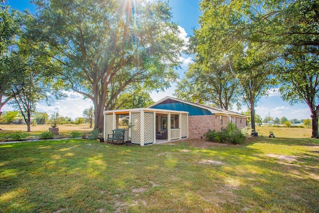 back of house with a yard