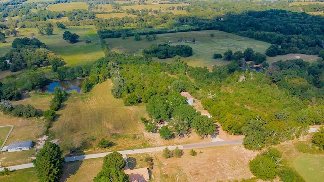 birds eye view of property featuring a rural view and a water view