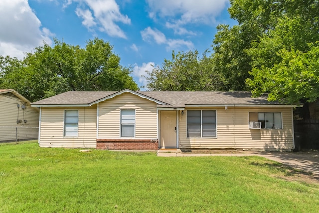 single story home featuring cooling unit and a front lawn