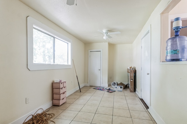 interior space featuring ceiling fan