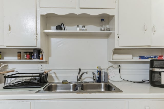 kitchen with white cabinets and sink