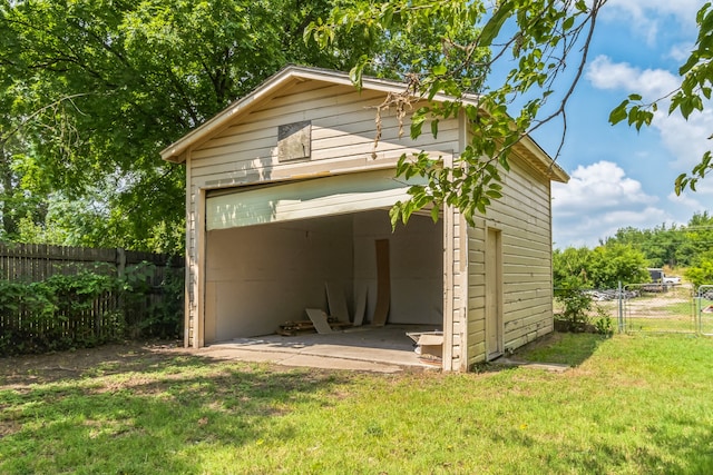 view of outbuilding featuring a yard