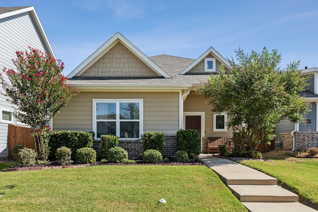 craftsman inspired home with a front yard