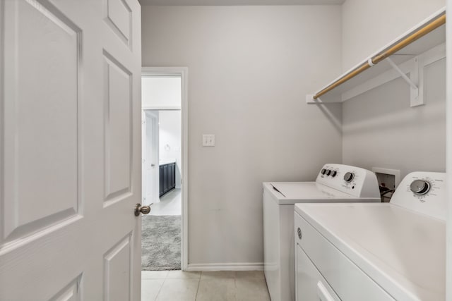 bathroom with separate shower and tub and tile patterned flooring