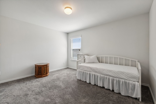 bedroom featuring dark carpet