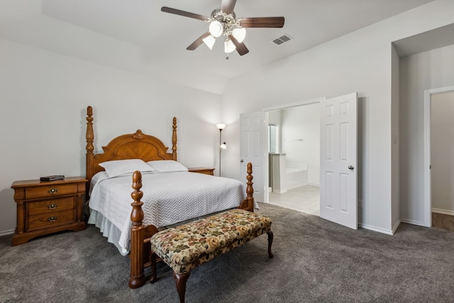 carpeted bedroom with ensuite bathroom, vaulted ceiling, and ceiling fan