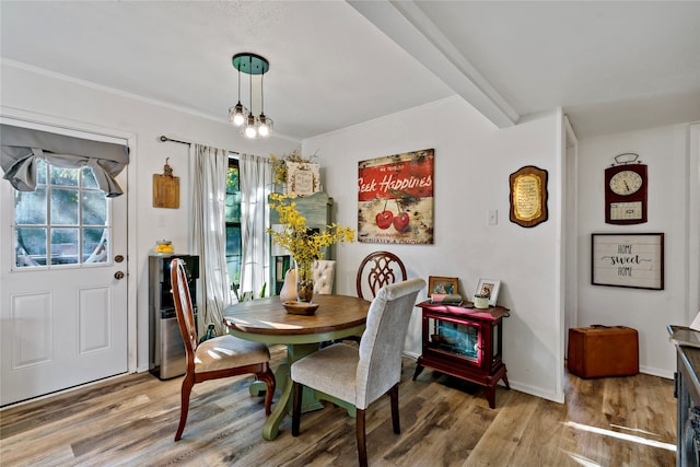 dining area featuring hardwood / wood-style floors, a chandelier, and a wealth of natural light