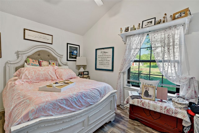 bedroom with wood-type flooring and lofted ceiling